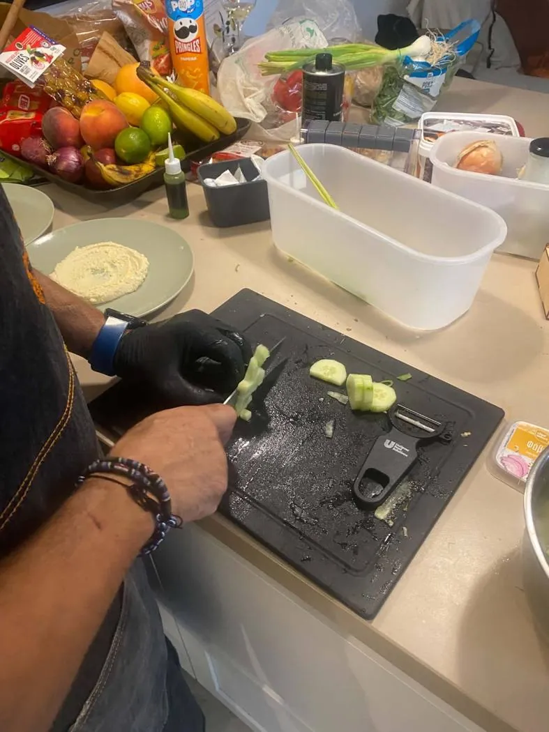 Chef Dimitris preparing a plated dish
